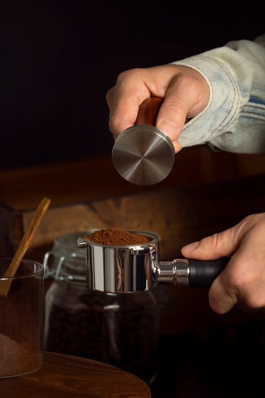 ES-front-view-man-making-coffee